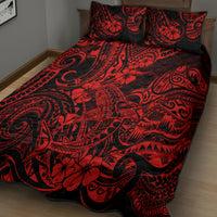 Red and black quilt bed set with two patterned pillow covers on the bed