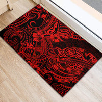 Rectangular red and black Polynesian print rubber doormat with swirl designs