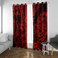 Red and black Polynesian patterned curtain panels framing a white doorway