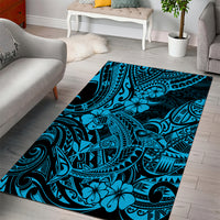 Blue Polynesian-style area rug with shark and tribal motifs plus flower accents, flat woven design