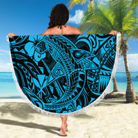 Round beach blanket held up, sky blue Polynesian shark design with fringe
