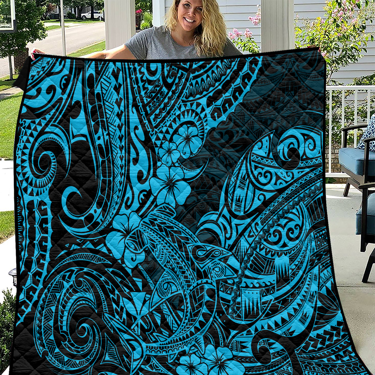 Polynesian shark quilt in dark blue with bright turquoise tribal swirl and flower pattern
