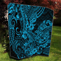 Polynesian shark quilt on lawn, black-and-turquoise tribal swirls with flower accents