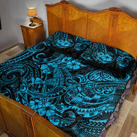 Blue and black Polynesian pattern quilt bed set with two pillow shams, full bed view