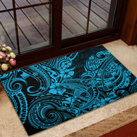 Blue Polynesian-pattern rubber doormat with dark border, rectangular, bold motifs