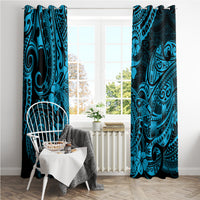 Blue window curtain panels with dark shark-and-ornament motif, displayed in a bright room