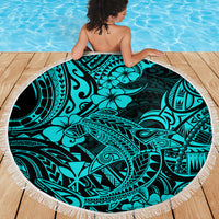 Circular turquoise beach blanket featuring shark tribal pattern, white fringed edge