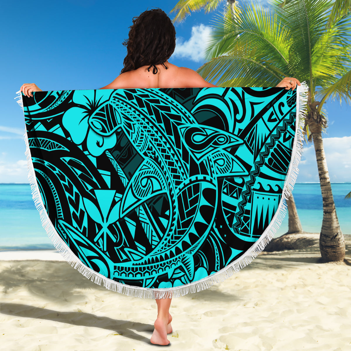 Turquoise round beach blanket with shark tribal pattern and white fringe