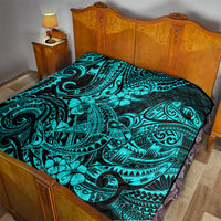 Turquoise shark motif quilt blanket on bed, black background with teal decorative swirls