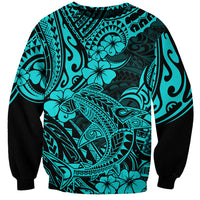 Unisex turquoise sweatshirt with black sleeves and bold Polynesian shark graphic