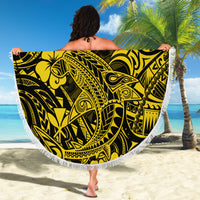 Round beach blanket with bold yellow-on-black tribal shark and hibiscus design plus fringe.