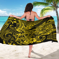 Yellow sarong with black polynesian shark motif, wrap skirt shown from behind