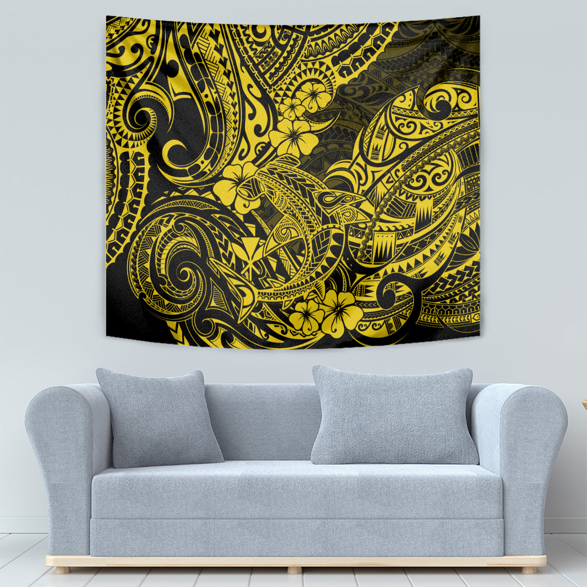 Yellow Polynesian shark tapestry on wall over gray sofa