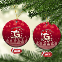 Red ceramic Christmas ornaments, round discs with Santa riding reindeer and letter G, “Merry Christmas”