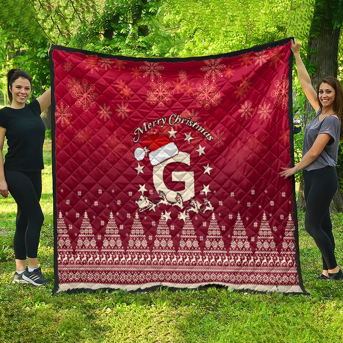 Red outdoor quilt blanket with “Merry Christmas,” Santa riding reindeer and stars