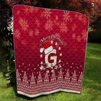 Red quilt throw blanket with “Merry Christmas” text and Santa riding reindeer design