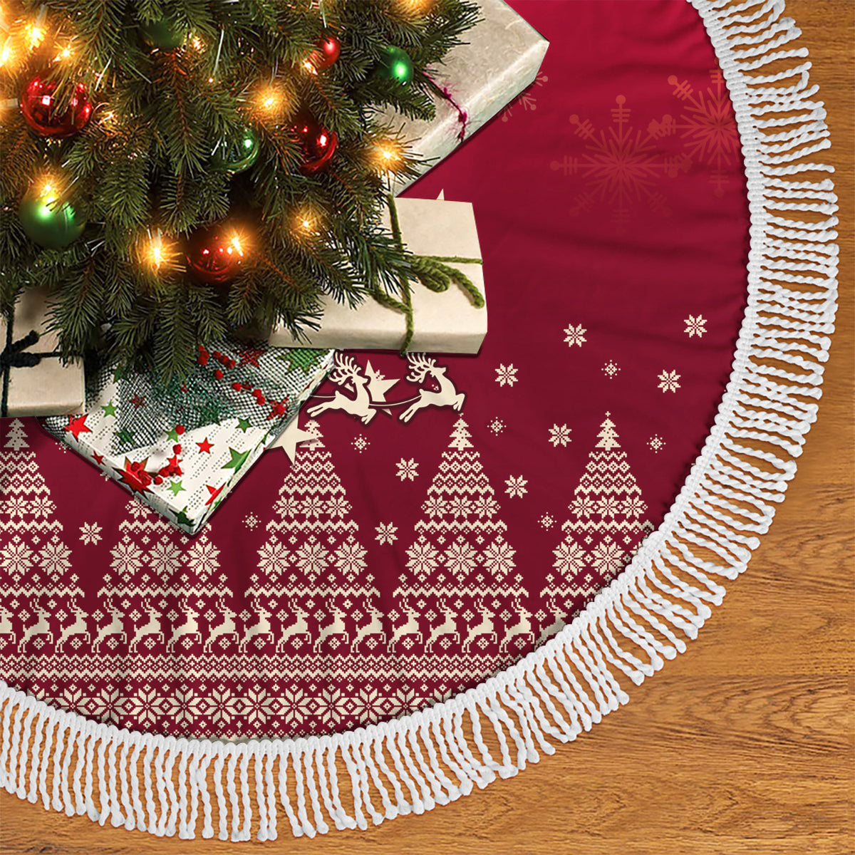 Red Christmas tree skirt with fair-isle pattern and white fringe trim along hem