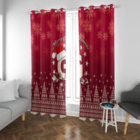 Red Christmas window curtains with Santa riding reindeer motif and repeating snowflake design