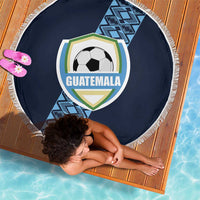Round navy beach blanket with white fringe and Guatemala crest soccer-ball graphic, laid flat