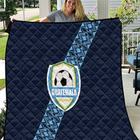 Navy football quilt with diamond quilting, diagonal blue stripe, and Guatemala crest