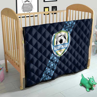 Navy football quilt on toddler bed, diamond quilting, diagonal blue stripe, Guatemala crest