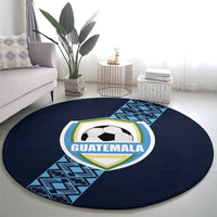 Round dark blue carpet with Guatemala shield logo, soccer ball emblem, and blue patterned strip