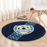 Round dark blue carpet with Guatemala crest and soccer ball, featuring blue geometric stripe