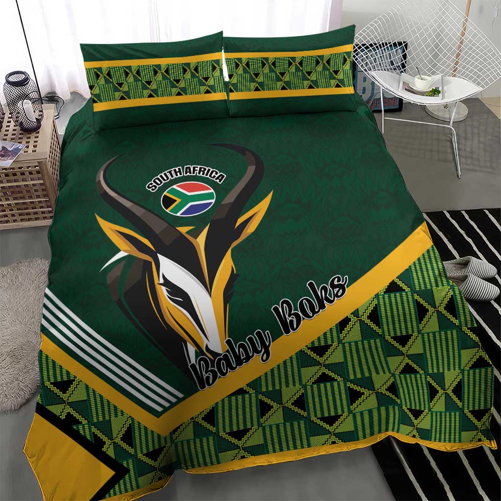 Green baby bedding set featuring rugby bird graphic, yellow stripe border, geometric plaid