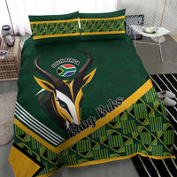 Green baby bedding set featuring rugby bird graphic, yellow stripe border, geometric plaid