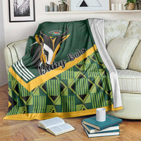 Green baby blanket with 'Baby Boks' rugby emblem and yellow plaid border