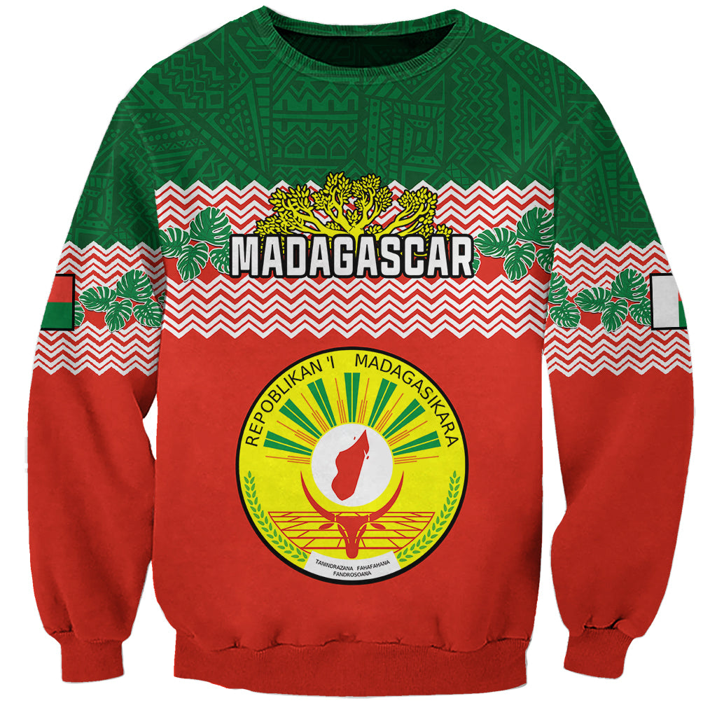 Red and green crewneck sweatshirt with Madagascar crest seal and zigzag pattern