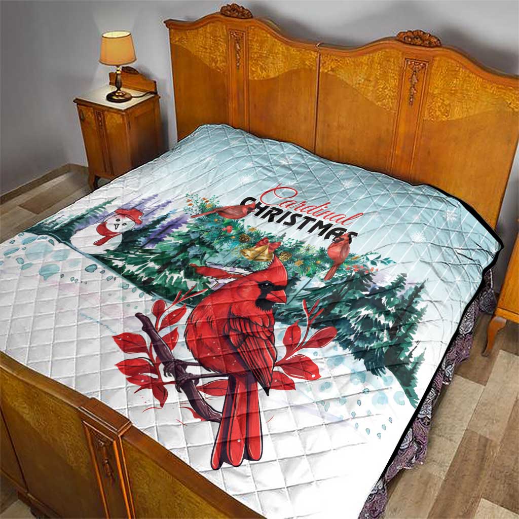 Light blue quilt blanket on bed with Cardinal Christmas artwork, quilted diamond stitching
