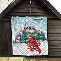 Light blue Cardinal Christmas quilt blanket hung on wall, red cardinal, snow and evergreens
