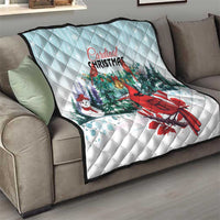 Light blue quilt throw blanket with Cardinal Christmas design on sofa, diamond stitch texture