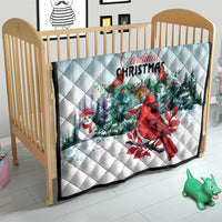 Light blue Cardinal Christmas quilt blanket on crib, red cardinal, snowman and evergreen trees