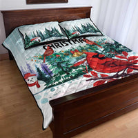 Mint quilt bed set with two pillows featuring red cardinals, pine trees, and snowman