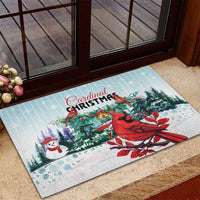 Mint rubber Christmas doormat with red cardinals, evergreen trees, and holiday text
