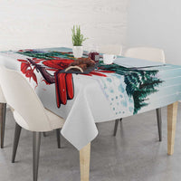 Mint Christmas tablecloth with red cardinal, pine branches, and falling snow dots