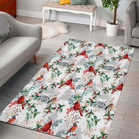 White area rug featuring red cardinals and green foliage with gray-blue birds