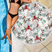Round beach blanket in white with cardinal and holly pattern, fringed edge