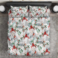 White bedding set with red cardinal and green foliage pattern, matching pillowcases