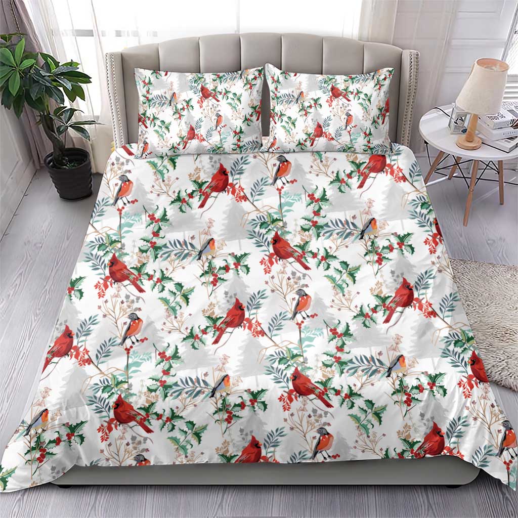 White quilted bedding set with red cardinals, blue-gray birds, and green leaf pattern