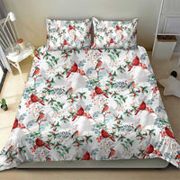 White bed set with red cardinal and gray bird motifs plus green leaf and berry pattern