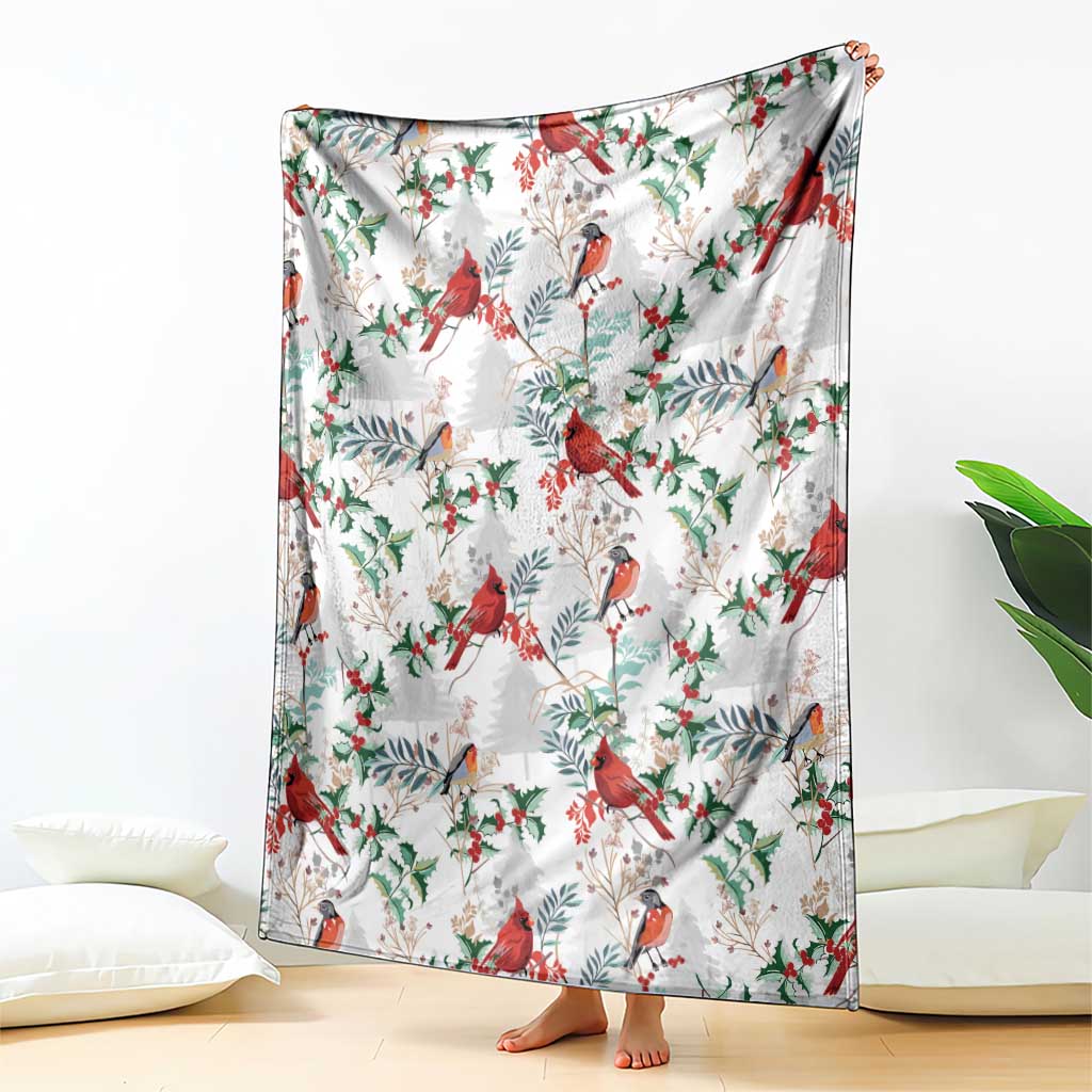 Christmas blanket with cardinal bird and holly leaf pattern, draped over bed