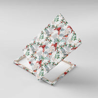 Diamond-angled view of Christmas canvas wall art with red cardinals and green foliage