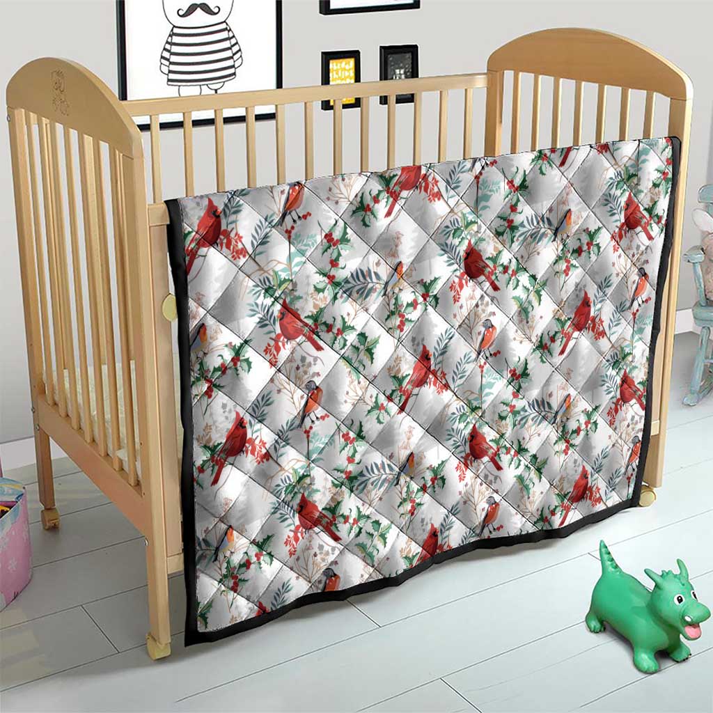 White baby quilt in crib with red cardinals, green leaves, and diamond-quilt pattern