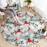 Round Christmas rug with cardinal birds and holly leaves on a light gray base