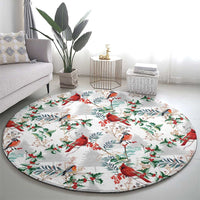 Round Christmas rug with red cardinals and green foliage branches on a light gray