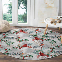 Round cardinal-pattern Christmas rug with red birds and green leaves on light gray