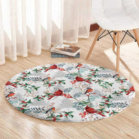Round Christmas rug with red cardinals and holly leaves on a light gray base